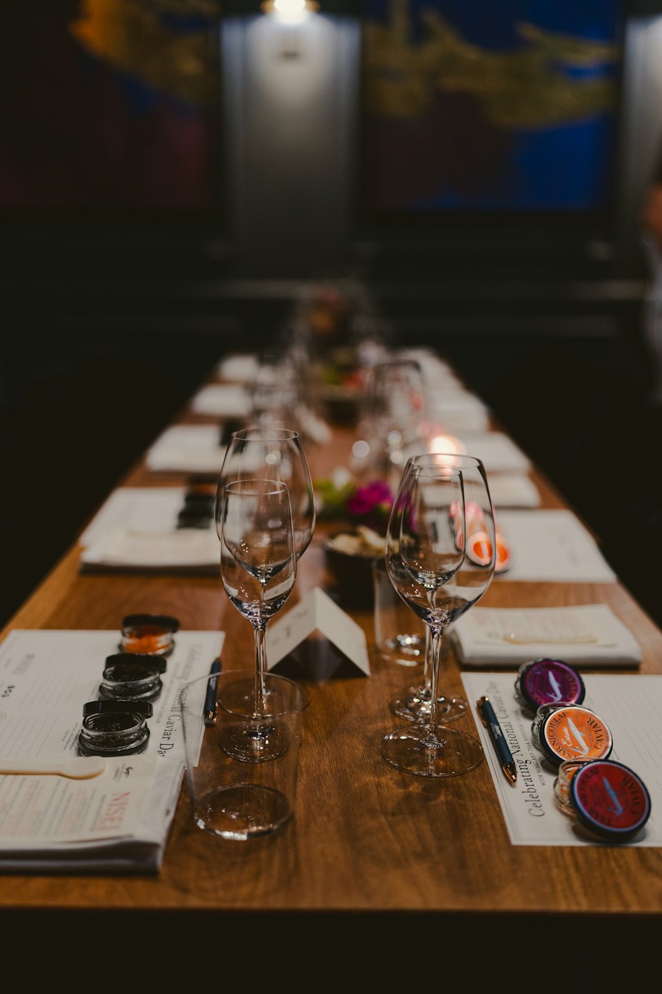 Wooden table set for fine dining with caviar tasting.